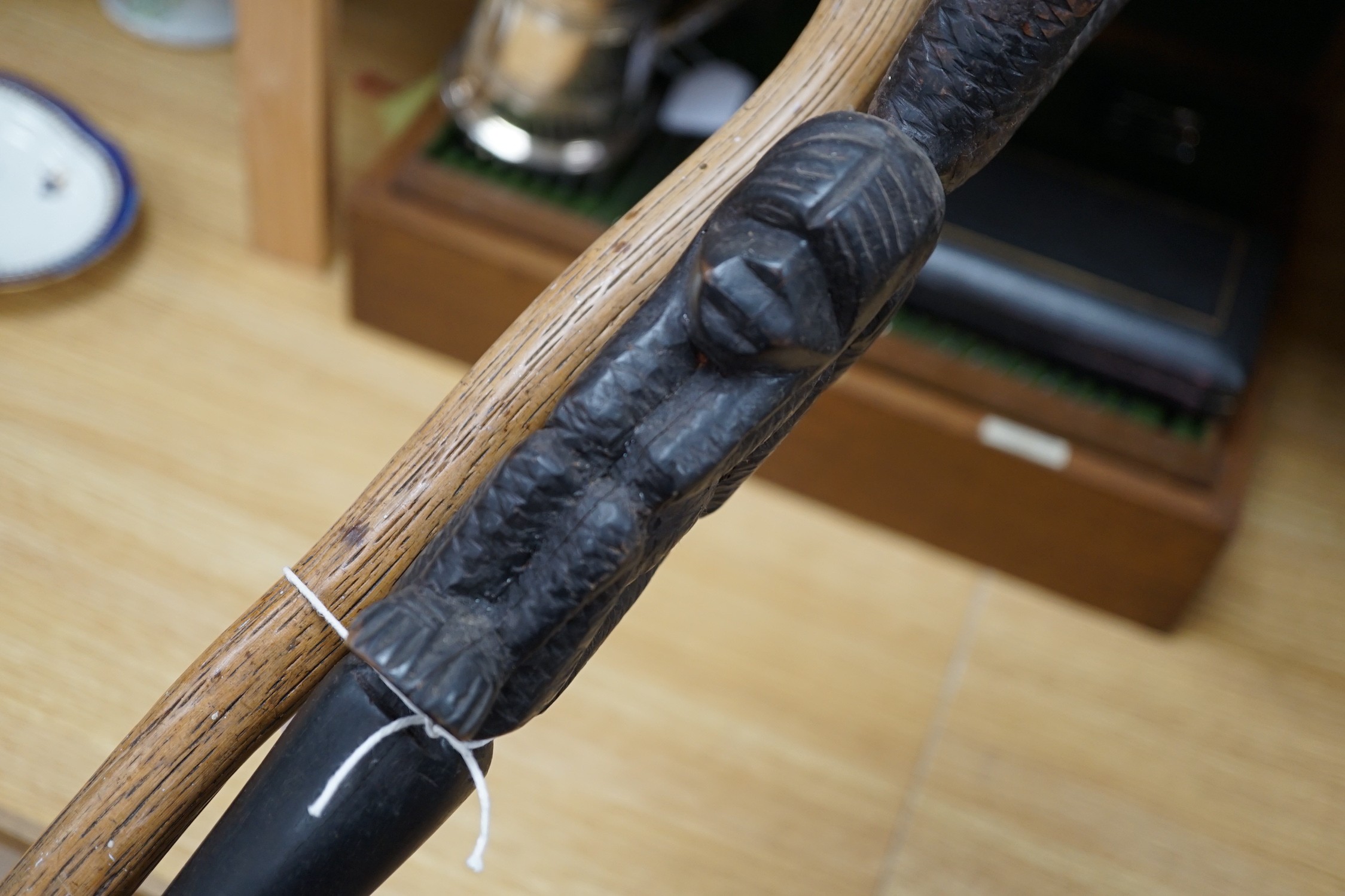 An African carved wood walking cane and a ‘dogs head’ walking cane